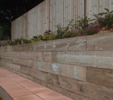 Wooden sleepers make a very strong wall.