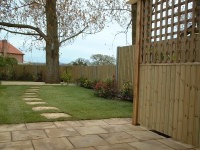 Heritage paving and stepping stones lead to deck area. 