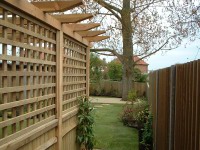This garden offers many features including arbour dining area, paving, stepping stone path and deck.
