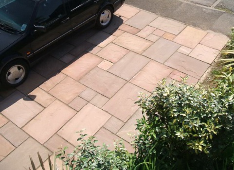 This front garden patio in modak / brown stone is strong enough to park on